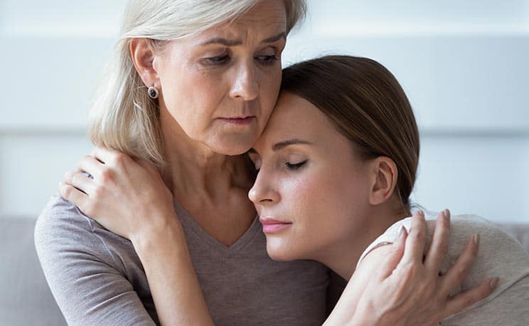 Older Woman Consoling Younger Woman