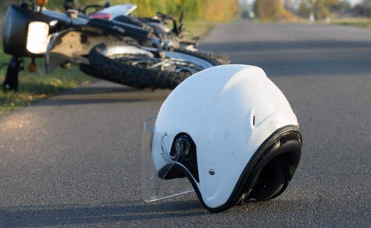 motorcycle helmet lying in the street following accident