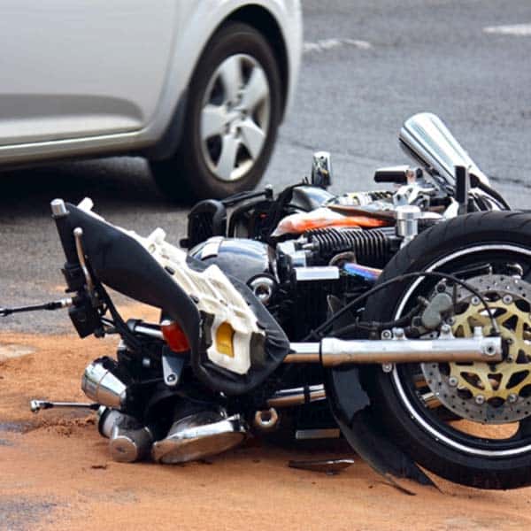 motorcycle lying in the street after accident